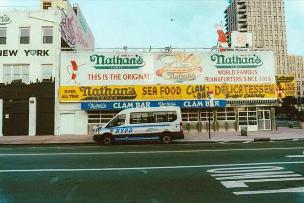 Nathan's Famous on Coney Island at dawn during The Warriors 2026