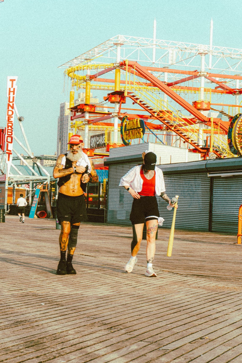 Two runners on the Coney Island boardwalk during The Warriors 2026