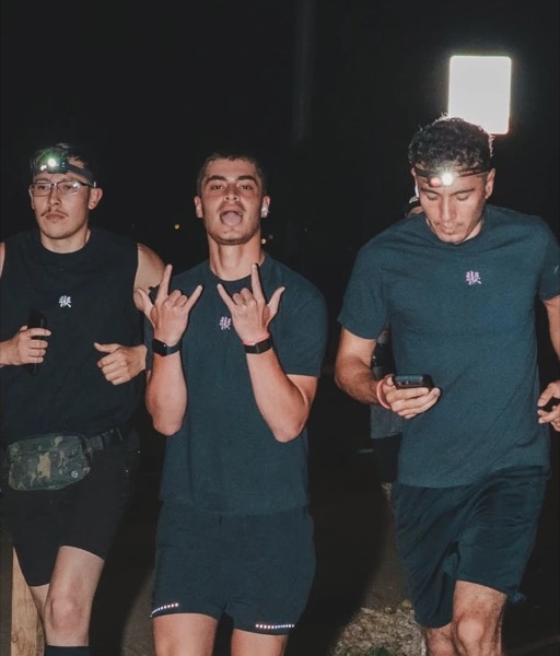 Three runners in headlamps at night during the Vivo Midnight 25K/50K
